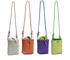 Small in size, strong in character.

This compact sling bag is built around a tall, bucket-style silhouette with a tactile textured outer body and a soft drawstring inner pouch. The long rope strap keeps the look relaxed and functional, while knotted details and utility hardware give it a more experimental feel than a conventional mini bag.

Designed for days when you only want to carry the essentials, it sits comfortably against the body without feeling bulky. The narrow shape keeps it easy to move around 
