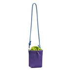 Small in size, strong in character.

This compact sling bag is built around a tall, bucket-style silhouette with a tactile textured outer body and a soft drawstring inner pouch. The long rope strap keeps the look relaxed and functional, while knotted details and utility hardware give it a more experimental feel than a conventional mini bag.

Designed for days when you only want to carry the essentials, it sits comfortably against the body without feeling bulky. The narrow shape keeps it easy to move around 