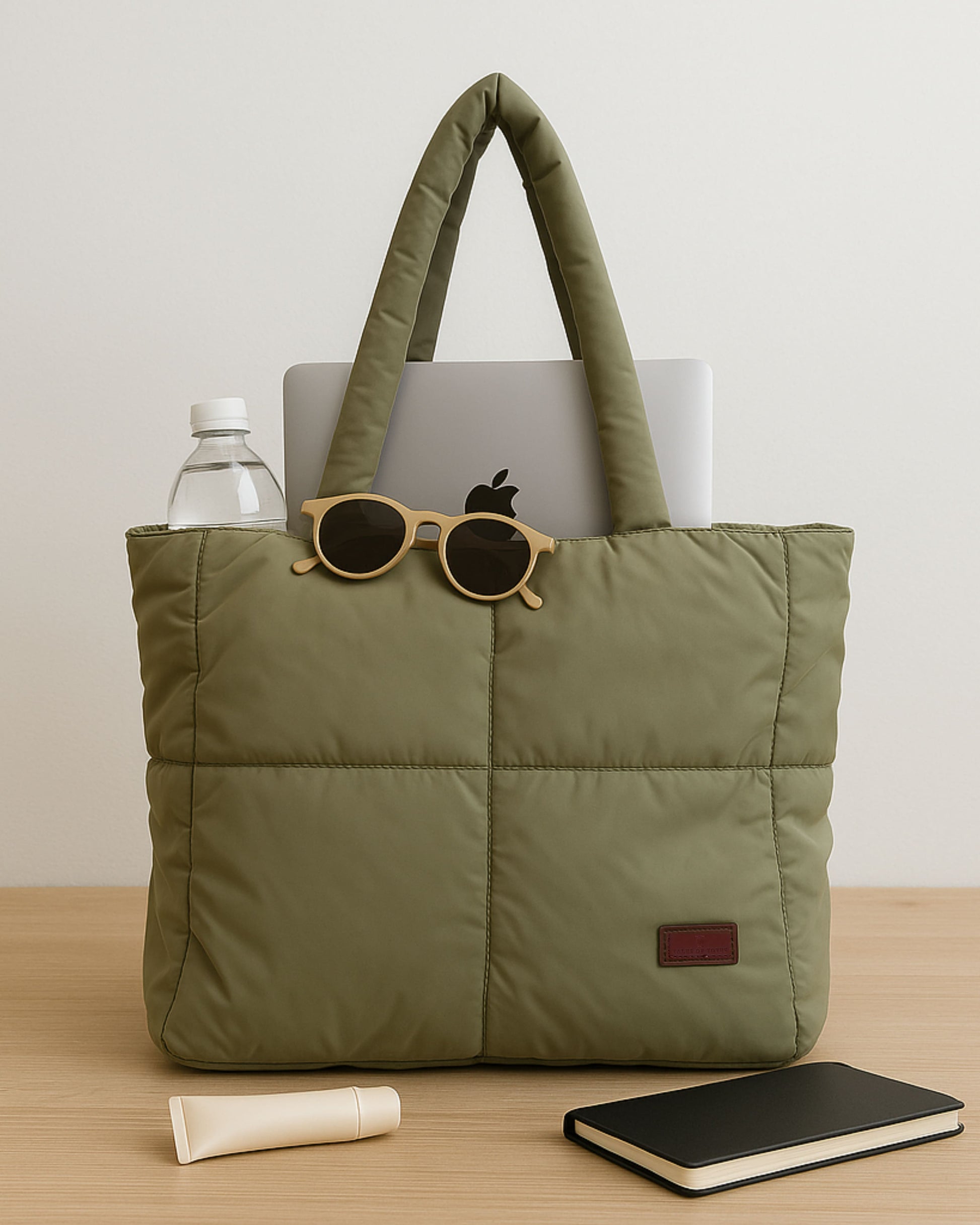 Quilted puffer tote bag with padded handles and a soft structured silhouette – lightweight, stylish, and perfect for daily use, college, travel, or shopping. Designed for comfort and statement appeal, this spacious carryall from Tales of Totes is a trendy alternative to Zouk, Lavie, and DailyObjects in India’s fashion accessories market."