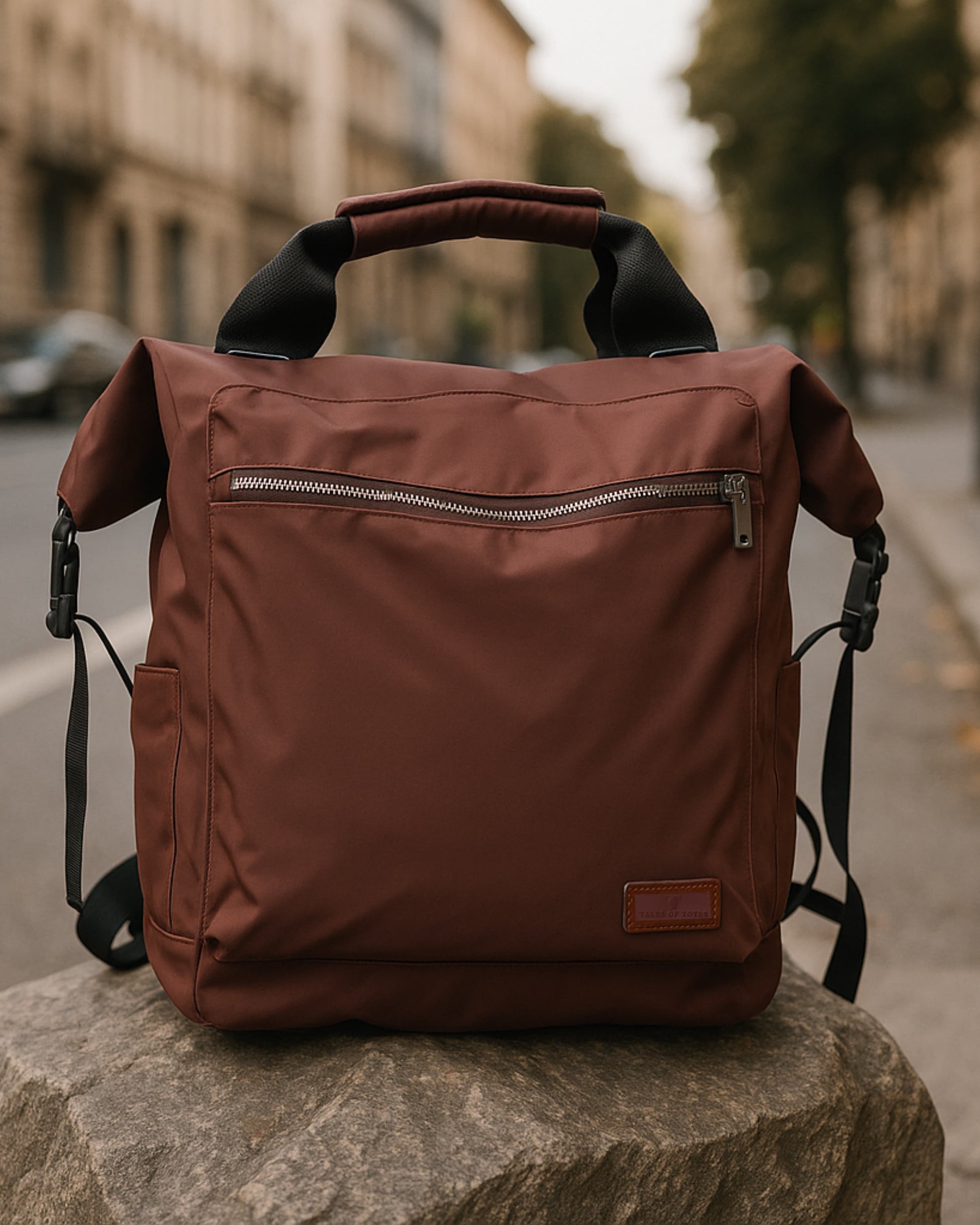 "Modern utility backpack with a structured silhouette, front zip pocket, padded handle, and side compartments – designed for daily commuting, travel, or college use. Features durable water-resistant material, sleek zipper details, and adjustable shoulder straps. A functional and fashion-forward choice from Tales of Totes for urban Indian lifestyles."

