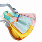 Trendy multi-color casual college tote bag with mesh detailing and adjustable straps.