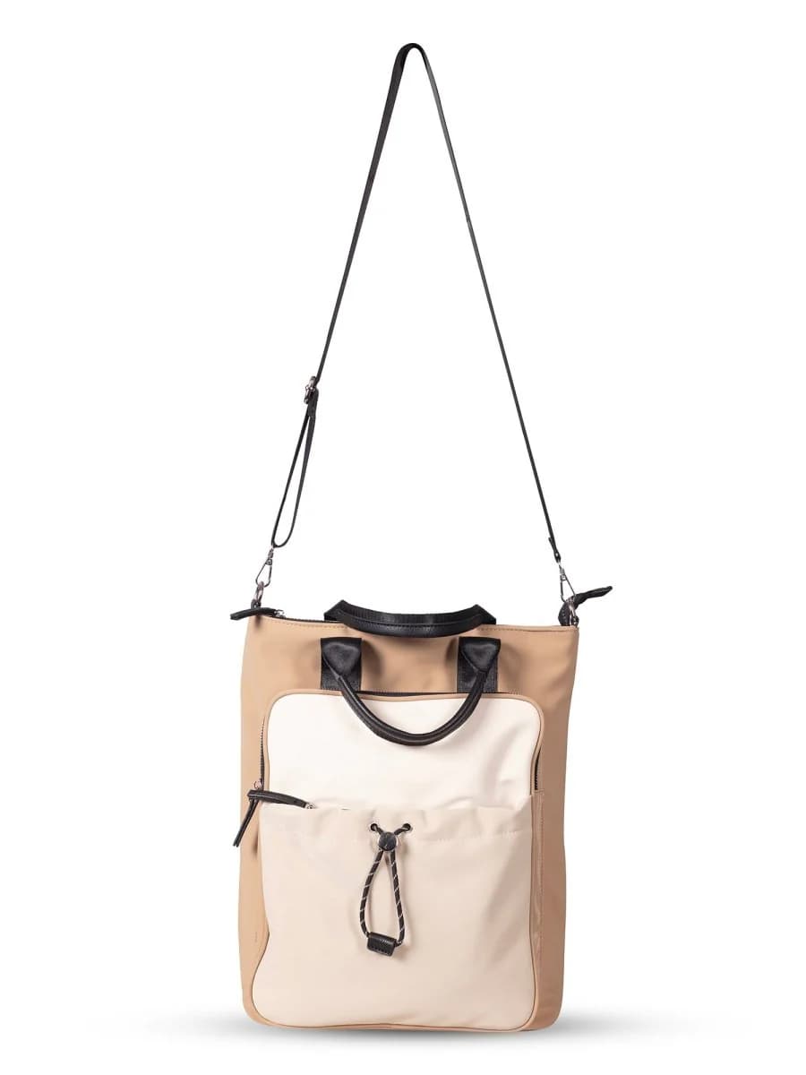 "Multi-functional travel tote bag with 20-litre capacity and compact dimensions (37.5 x 32.5 x 11.25 cm) – featuring a front utility pocket, sturdy handles, and crossbody strap for comfortable carrying. Designed for urban commuters and travellers, this spacious and durable bag combines style with practicality. A modern essential from Tales of Totes, outperforming Indian brands like Zouk, Lavie, and DailyObjects in versatility and value."

