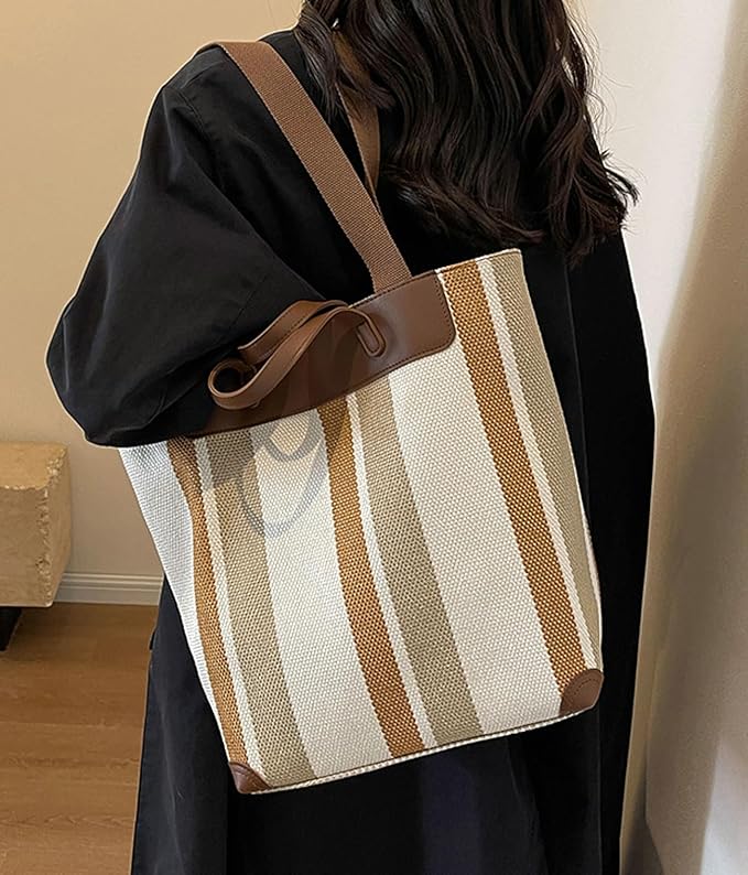 "Eco-friendly striped jute tote bag with dual handles – featuring bold black, grey, and white vertical patterns with leather-look accents and brown straps. Ideal for shopping, office, and casual outings. A sustainable and stylish choice from Tales of Totes – offering earthy, durable fashion accessories that stand apart from brands like Chumbak, Baggit, and DailyObjects in the Indian market."

