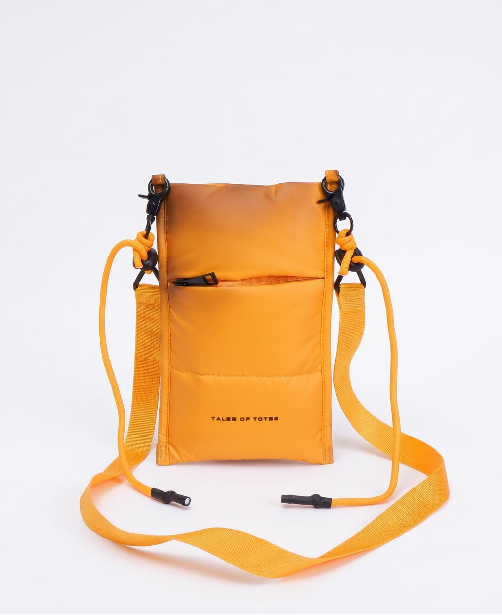 Orange crossbody bag with a strap on a white background